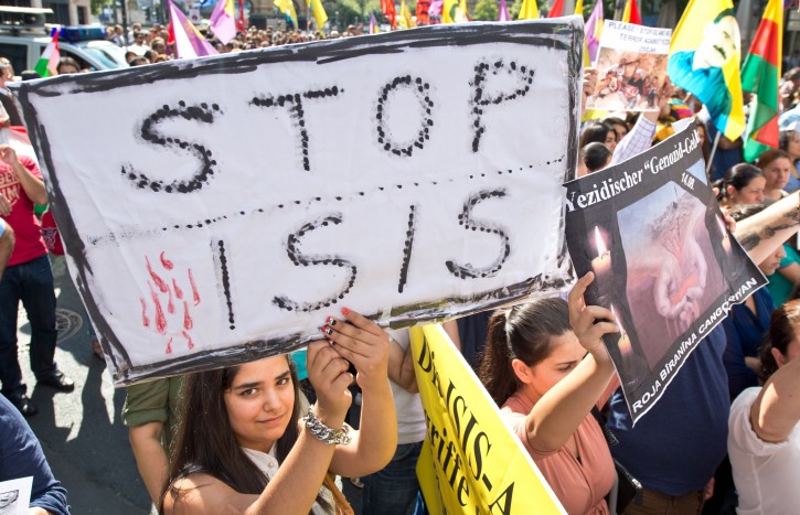Kurds and Yazidi take part in a protest rally in Frankfurt Main, Germany, 09 August 2014. They protested against the invasion of large parts of the Iraq by the jihadist group Islamic State (IS).  EPA/BORIS ROESSLER