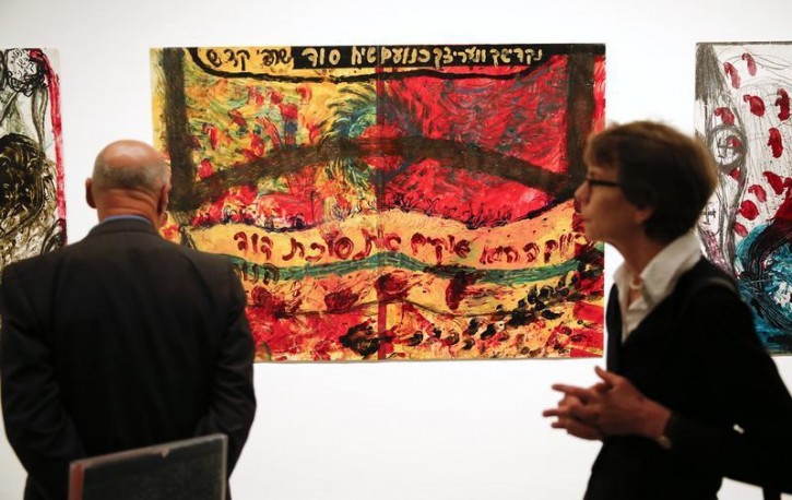 A visitor looks at the artwork "David" by Israeli artist Moshe Gershuni during the opening of his solo exhibition in Berlin September 12, 2014. Gershuni's art exhibition "No Father, No Mother" opened at German art museum, the New National Gallery, on Saturday for a three-month run. Picture taken September 12, 2014.      REUTERS/Fabrizio Bensch 