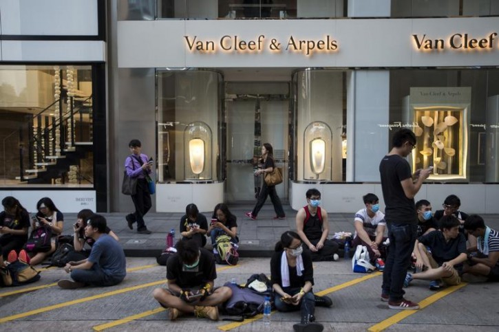 A luxury store is closed as thousands of protesters occupy a main street to the financial Central district in Hong Kong September 29, 2014.  Reuters
