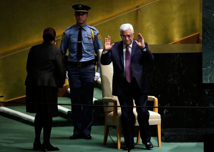 Palestinian President Mahmoud Abbas acknowledges audience applause after his address to the 69th session of the United Nations General Assembly, at U.N. headquarters, Friday, Sept. 26, 2014. (AP Photo/Richard Drew)