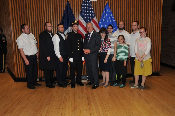Joel Witriol with his family as he is promoted to Sergeant on Sept. 5, 2014