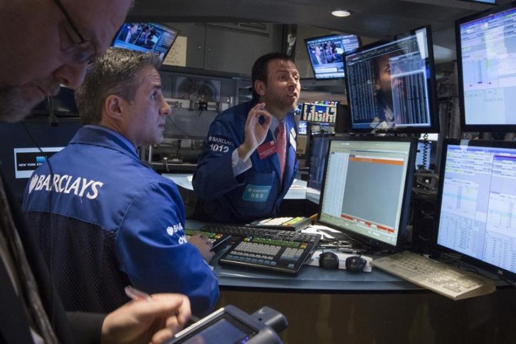 Traders work on the floor of the New York Stock Exchange October 1, 2014. REUTERS/Brendan McDermid