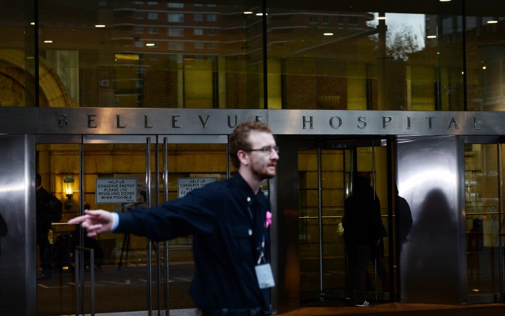  A hospital employee directs television camera's to a different location outside the main entrance to the Bellevue Hospital Center in New York, New York, USA, 23 October 2014. EPA
