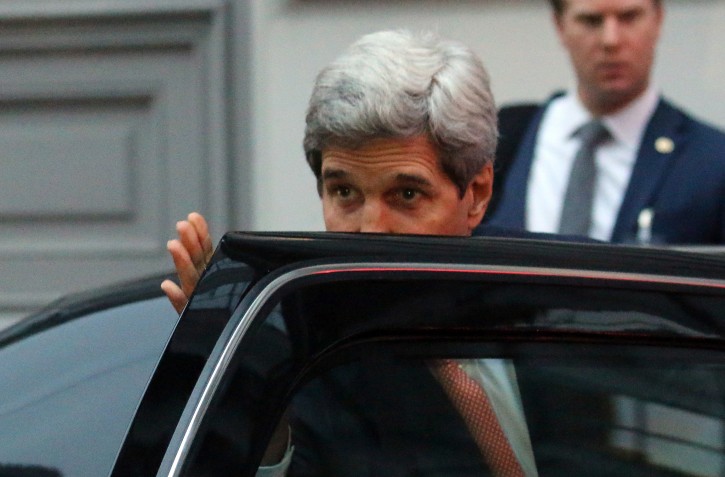 U.S. Secretary of State John Kerry leaves Palais Coburg where closed-door nuclear talks with Iran take place in Vienna, Austria, Friday, Nov. 21, 2014. Kerry decided to pull back from nuclear talks in Vienna, leaving Iran's foreign minister to ponder an apparent new proposal from Washington meant to bridge differences standing in the way of a deal with less than four days to deadline. (AP Photo/Ronald Zak)