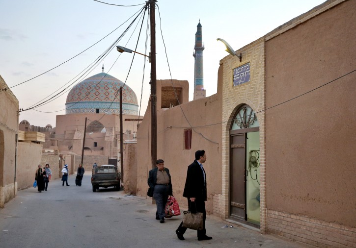 In this Thursday, Nov. 20, 2014 photo, Iranian Jews men enter the Molla Agha Baba Synagogue, in the city of Yazd 420 miles south of capital Tehran. Iran. (AP Photo/Ebrahim Noroozi)