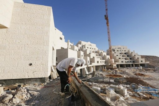 FILE - A Palestinian labourer works on a construction site in Israel, July 28, 2013. REUTERS