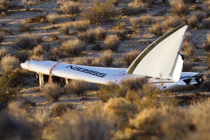 Wreckage lies near the site where a Virgin Galactic space tourism rocket, SpaceShipTwo, exploded and crashed in Mojave, Calif. Saturday, Nov 1, 2014. The explosion killed a pilot aboard and seriously injured another while scattering wreckage in Southern California's Mojave Desert, witnesses and officials said. (AP Photo/Ringo H.W. Chiu)