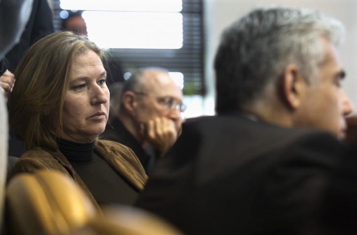Israeli Justice Minister Tzipi Livni (L) and Finance Minister Yair Lapid (R) listen to Prime Minister Benjamin Netanyahu (not pictured), discussing his new nationality law as the cabinet meets in the Prime Minister's office in Jerusalem, Israel, 23 November 2014. EPA/JIM HOLLANDER / POOL