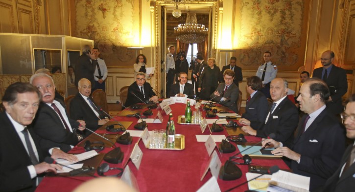 French foreign minister Laurent Fabius, third from right, meets with Palestinian ambassadot to France  Hael Al Fahoum, left, and Palestinian foreign minister Riyad al-Maliki, second from left, at the Quai d'Orsay in Paris, Tuesday Dec. 16, 2014. France is trying to overcome resistance and rally international support for a draft U.N. plan seeking a two-year deadline for peace talks on Palestinian statehood. (AP Photo/Remy de la Mauviniere)