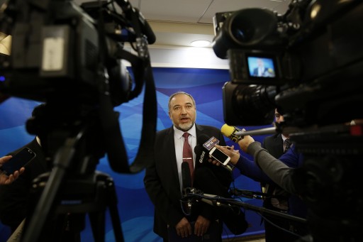FILE - In this Dec. 28, 2014 file photo, Israel's Minister of Foreign Affairs Avigdor Lieberman, speaks to the media ahead of the weekly cabinet meeting in Jerusalem. (AP Photo/Gali Tibbon, File)