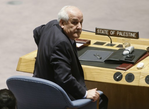 Palestinian Ambassador to the United Nations Riyad Mansour waits for the start of a meeting of the U.N. Security Council Tuesday, Dec. 30, 2014, at the United Nations headquarters. (AP Photo/Frank Franklin II)