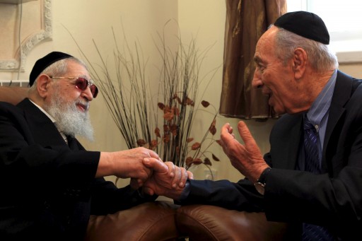 FILE - Israeli President Shimon Peres meets in Jerusalem with Shas spiritual leader Rabbi Ovadia Yosef Zt'l during Passover. EPA