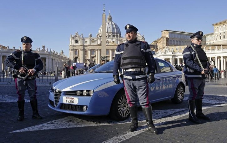 Italian policemen patrol in front of Saint Peter's Square in Rome January 12, 2015.  REUTERS