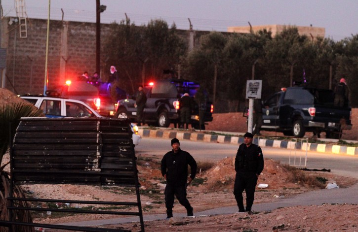 Jordanian security stand guard outside Swaqa prison, after the executions of Sajida al-Rishawi and Ziad al-Karbouly, two Iraqis linked to al-Qaida, about 50 miles (80 kilometers) south of the Jordan's capital, Amman, Wednesday, Feb. 4, 2015.  (AP Photo/Raad Adayleh)