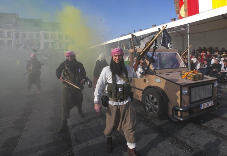 Revelers dressed as Islamic State militants take part in the 87th carnival parade of Aalst, Belgium February 15, 2015. REUTERS/Yves Herman