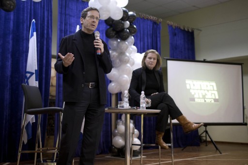 File: Co-leaders of Zionist Camp centre-left political alliance, Labor Party leader Isaac Herzog (L) and Hatnuah party leader Tzipi Livni (R) speak with an audience in Moshav Hagor near the city of Kfar Saba, 11 February 2015. EPA/ABIR SULTAN