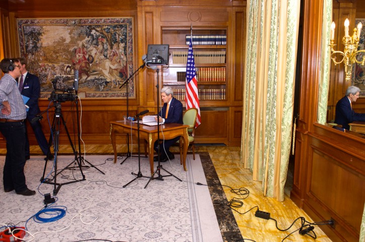 U.S. Secretary of State John Kerry reviews his notes on March 27, 2015, before recording video remarks for a meeting of U.S. Chiefs of Mission gathered in Washington, D.C., while he participated in Iranian nuclear negotiations in Lausanne, Switzerland. [State Department Photo / Public Domain]