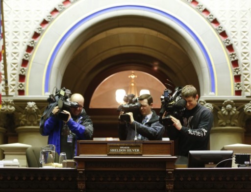 Photographers record former Assembly Speaker Sheldon Silver's seat in the Assembly Chamber at the state Capitol on Thursday, Jan. 22, 2015, in Albany, N.Y. (AP Photo/Mike Groll) 