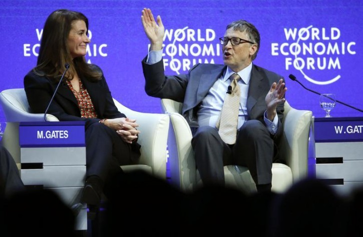 FILE - Bill Gates, Co-Chair of the Bill & Melinda Gates Foundation gestures next to his wife Melinda French Gates during the session 'Sustainable Development: A Vision for the Future' in the Swiss mountain resort of Davos January 23, 2015.  Reuters