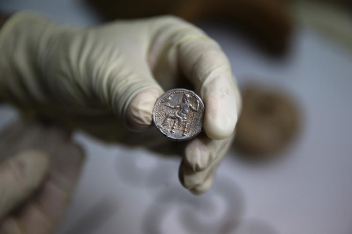 A recently uncovered coin from the time of Alexander the Great is displayed in Jerusalem March 9, 2015.REUTERS