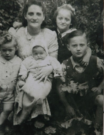 This photograph, taken in 1947 in Dzierzoniow, Poland, shows Moshe Tirosh as a boy with his mother and siblings. Tirosh incredibly survived the Holocaust, being thrown out of the Warsaw Ghetto in a sack before being hidden at the zoo. He was later abandoned in the rubble of the city after the Warsaw Uprising, but miraculously lived to the end of the war with other Polish orphans. Then named Mieczyslaw Kenigswein, Tirosh is the boy on the right. Mother Regina is at the top left, with daughter Stefania by her side. In the front are children Stanislaw and Rachel. (Moshe Tirosh Archive via AP)