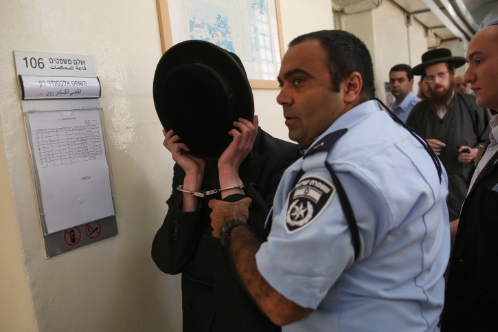 An Ultra Orthodox youth is brought to the Jerusalem Magistrate's Court after being arrested for beating up an Israeli soldier in the Ultra Orthodox neighborhood of Meah Shearim, May 19, 2015. Photo by Hadas Parush/Flash90