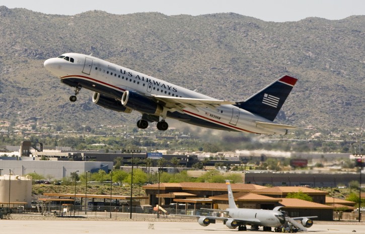 FILE - In this April 8, 2010 file photo, a US Airways plane takes off from Sky Harbor International Airport in Phoenix. American Airlines on Tuesday, May 12, 2015 said it plans to shut down the venerable carrier over a 90-day stretch that could begin as soon as July, which would mean a final departure around October. (Cheryl Evans/The Arizona Republic via AP)