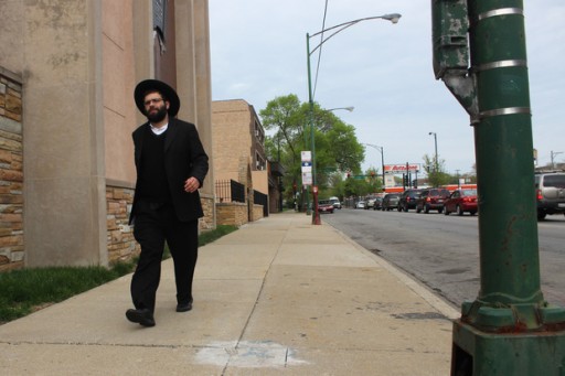 A Jewish man, who only identified himself as Israel, walks on Touhy Avenue in West Rogers Park. (Courtesy DNAINFO.com)