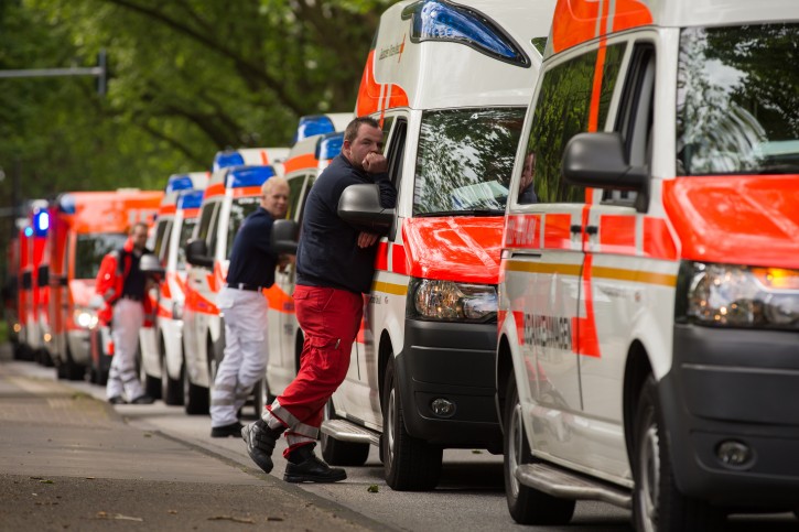Ambulances wait at a social services facility after a WWII one-tonne bomb was discovered near the Muelheim bridge in Cologne, Germany, 27 May 2015. About 20,000 people were forced to leave their homes while the bomb was made safe.  EPA/ROLF VENNENBERND