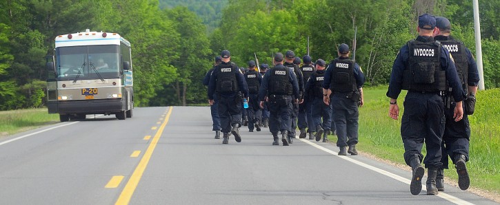 Law enforcement officers make their way down Pickettâs Corners Road heading towards Saranac SundayJune7,2015 near Dannemora. Two inmates, David Sweat and Richard Matt, escaped Saturday morning from Clinton Correctional Facility and are still at large. (AP_ Press-Republican, Rob Fountain)