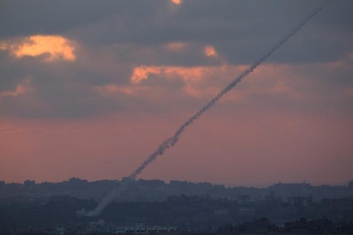 FILE - Smoke trails are seen as rockets are launched from the Gaza Strip towards Israel as seen from the Israeli border August 23, 2014. REUTERS