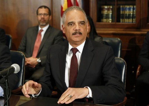 File photo of former U.S. Attorney General Eric Holder talking to the media in Washington March 12, 2015. REUTERS/Yuri Gripas