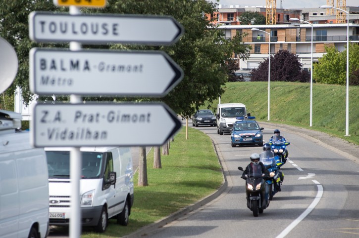  A white van, accompanied by police motorcycles and a police car transporting what is believed to be debris from a Boeing 777 plane that washed up on an Indian Ocean island, on route to Direction Generale de L'armement (DGA) facilities in Balma, near Toulouse, south-western France, Saturday, Aug. 1, 2015. A piece of plane wing that could be from missing Malaysia Airlines Flight 370 arrived Saturday in Toulouse, France, for inspection by military aviation experts.The 6-foot-long part, wrapped in a box and shipped as cargo, was flown from the small island of Reunion, near Madagascar. (AP Photo/Fred Lancelot)