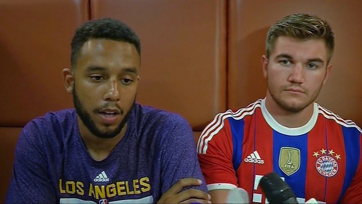 In this image made from TV, Anthony Sadler, a senior at Sacramento State University, left, sits with Alek Skarlatos, US National Guardsman from Roseburg, Oregon, who both helped overpower high-speed train attacker, talk to the media early Saturday Aug. 22, 2015, in Arras, France. Three Americans and a Briton are together being hailed as heroes for tackling and disarming a gunman aboard a high-speed train traveling between Amsterdam and Paris Friday evening. (AP Photo /APTN)