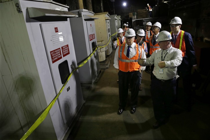 New Jersey state Sen. Stephen M. Sweeney, front left , D- West Deptford, N.J., listens as AMTRAK employee Rob Kane, front right, describes the workings of a bank of large electrical breakers in a tunnel below New York's Penn station Monday, Aug. 17, 2015, in Newark, N.J. A push to fund a new tunnel has gained momentum since electrical malfunctions in the 105-year-old tunnel caused several days worth of delays last month. Thats the scheduled topic when Gov. Chris Christie meets with federal transportation officials Tuesday in Washington. (AP Photo/Mel Evans)