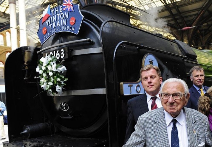 FILE - Sir Nicholas Winton (C) poses in front of the Winton train at Liverpool Street station in central London September 4, 2009.  Reuters