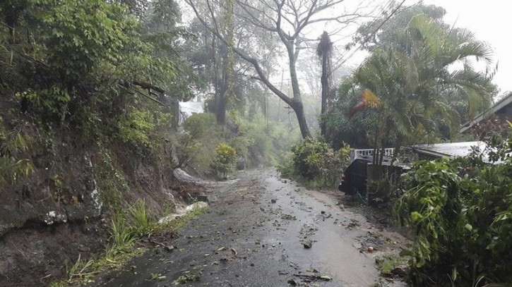 Debris covers a road after heavy rains from Tropical Storm Erika hit the Caribbean island of Dominica in this picture from Robert Tonge, Dominican Minister for Tourism and Urban Renewal, taken August 27, 2015. Reuters