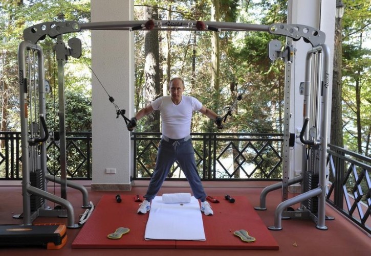 Russian President Vladimir Putin exercises in a gym at the Bocharov Ruchei state residence in Sochi, Russia, August 30, 2015.  REUTERS/Michael Klimentyev/RIA Novosti/Kremlin  