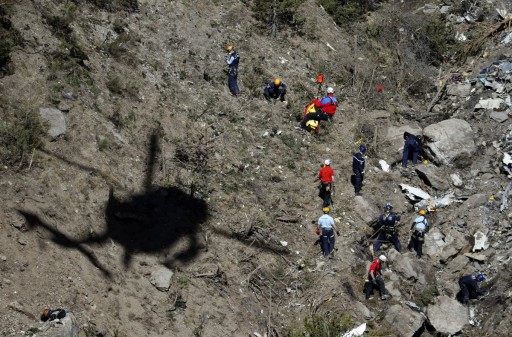French gendarmes and investigators work amongst the debris of the Airbus A320 at the site of the crash, near Seyne-les-Alpes, French Alps March 26, 2015.
REUTERS/Emmanuel Foudrot