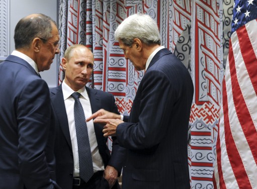 Russian President Vladimir Putin, center, and Foreign Minister Sergey Lavrov, left, with U.S. Secretary of State John Kerry, right, before a bilateral meeting at United Nations headquarters in New York, Monday, Sept. 28, 2015. (Mikhail Klimentyev, RIA-Novosti, Kremlin Pool Photo via AP)