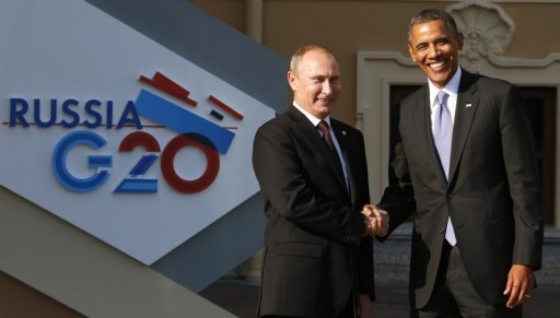 FILE - Russia's President Vladimir Putin (L) welcomes U.S. President Barack Obama before the first working session of the G20 Summit in Constantine Palace in Strelna near St. Petersburg, September 5, 2013.REUTERS/Grigory Dukor