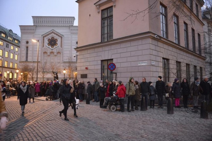 FILE - People gather to form a "ring of peace" around The Great Synagogue of Stockholm at Raoul Wallenberg, in central Stockholm February 27, 2015. 