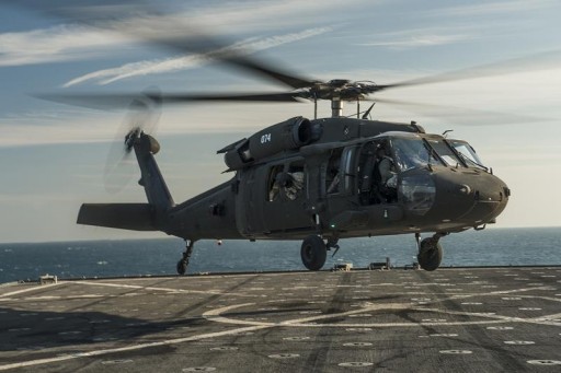 FILE - A U.S. Army UH-60 Blackhawk helicopter lands on the flight deck of the amphibious dock landing ship USS Harpers Ferry in the Arabian Gulf in a December 26, 2013 handout photograph.REUTERS