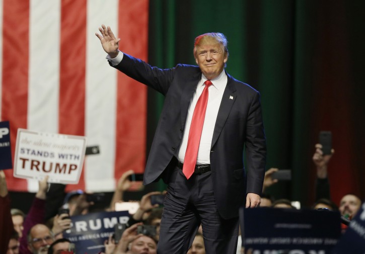 FILE - In this Dec. 21, 2015 file photo, Republican presidential candidate businessman Donald Trump acknowledges the crowd before speaking in Grand Rapids, Mich. . (AP Photo/Carlos Osorio, File)