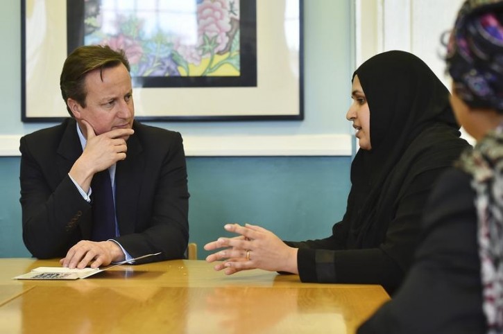 FILE - Britain's Prime Minister David Cameron listens during a discussion with members of the local Muslim community on a visit to Luton, north of London, on October 19, 2015. Reuters