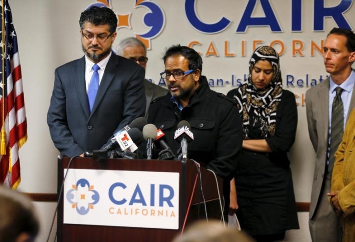 Farhan Khan (C), brother-in-law of San Bernardino, shooting suspect Syed Farook, speaks at the Council on American-Islamic Relations during a news conference in Anaheim, California December 2, 2015. REUTERS/Mike Blake