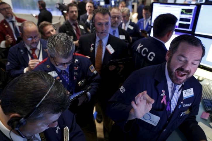 Traders work on the floor of the New York Stock Exchange December 3, 2015. REUTERS/Brendan McDermid  