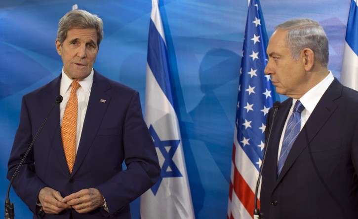 FILE - In this Tuesday, Nov. 24, 2015 file photo, Israel's Prime Minister Benjamin Netanyahu, right, looks on as U.S. Secretary of State John Kerry speaks during a meeting at the Prime Minister's Office, in Jerusalem. On Saturday, Kerry warned Israel about the dangers of the possible collapse of the Palestinian Authority, saying it would lead to a situation that would threaten the security of Israel and the Palestinian people. (Atef Safadi/Pool via AP)