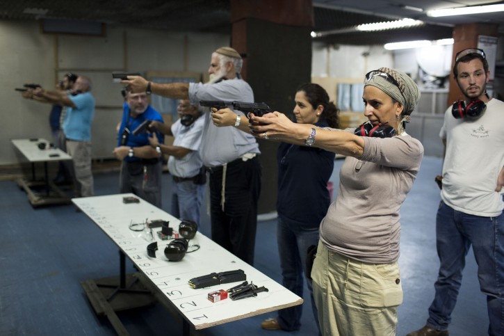 Israelis attend a weapons course as they practice their shooting skill at a shooting range in Jerusalem, Israel, 19 October 2015. EPA/ABIR SULTAN