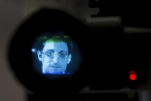 American whistleblower Edward Snowden is seen through a camera viewfinder as he delivers remarks via video link from Moscow September 24, 2015.  REUTERS/Andrew Kelly